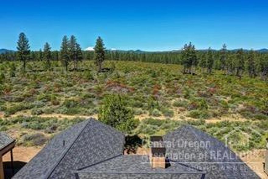 Build by BendTrend Homes with luxury finishes and craftsmanship including hardwood floors in the main living areas, quartz countertops in the kitchen and bathrooms, tiled showers and floors in the bathrooms, vaulted ceilings, an abundance of windows and covered exterior living spaces. This homesite features a spacious single-level floor plan with 4 bedrooms, 4 bathrooms, den and a 3-car garage. This premium Casacde view lot with exceptional butte and vista views borders the Deschutes National Forest, offering direct access to Phil's Trail system for mountain biking and hiking. The community is across from the Tetherow pool, fitness center, dining, and golf course. A social membership initiation fee is included. AlI photos are of other completed but sold homes and feature a combination of the chosen interior palette and floor plan. These private residences may not be used as vacation rentals but are discerning primary or secondary homes. An exceptional value for Tetherow living!