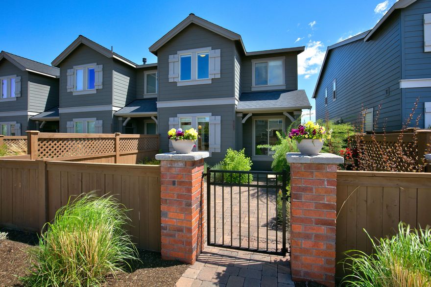 Turnkey townhome in McCall Landing! 3 bedrooms, 2.5 baths, fireplace, loft, open floorplan, & 2 car garage! Level parking, private and inviting courtyard, & fully applianced with washer, dryer, and refrigerator.  Great neighborhood close to shopping, hospital, trails, parks, and parkway.  A great property in the heart of Bend!