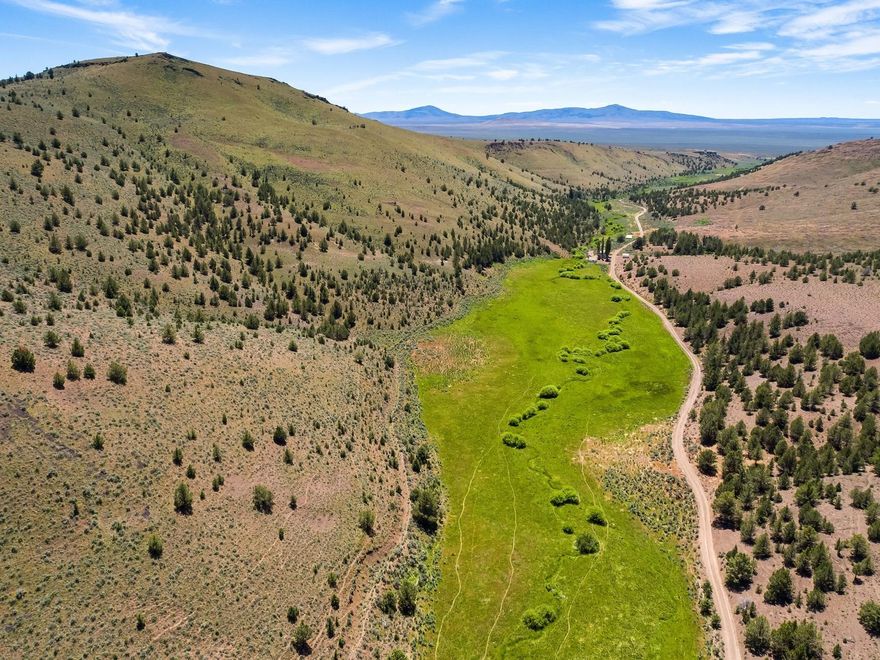 Buck Creek Ranch is a private, scenic and productive ranch with Buck Creek running through. The ranch is 9452 +/- deeded acres with naturally sub irrigated meadows, recreation rangeland and BLM/State Grazing Allotments offering a great opportunity for a livestock operation or seasonal grazing ranch. The improvements include a ranch home, new pipe corrals, juniper cuts, creek restoration projects and developed livestock water. The ranch has varied topography, high desert native grasses and is located approximately 1.5 hours from Bend, Prineville or Burns.