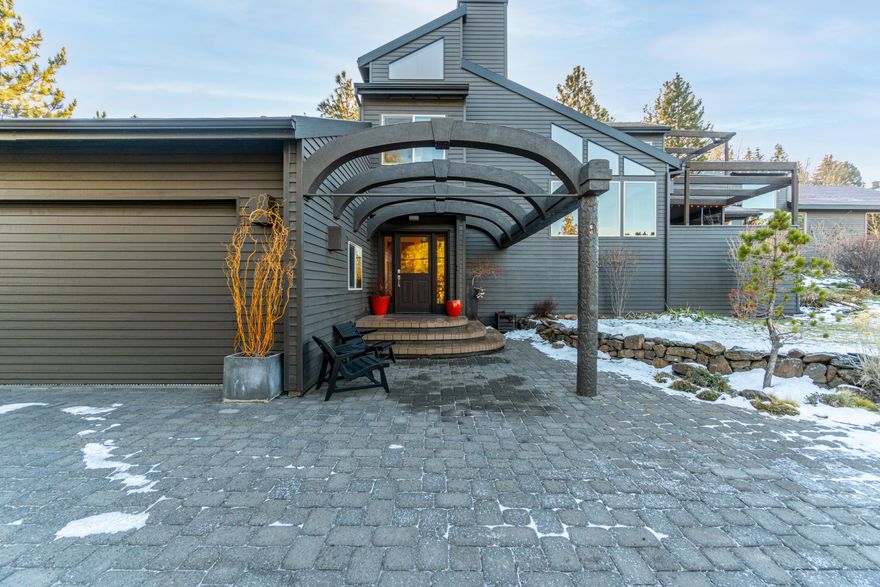 This is a wonderfully located property allowing one the privacy of space between neighboring homes and the close proximity to everything we love about bend; the recreational activities, downtown, shopping and restaurants! The home is 3 bed/2baths with the primary suite on the upper level with a private deck overlooking the neighborhood and mature pine trees. The open concept kitchen and living room has an abundance of natural light and views of the .48 acres of land that you can call your own. Additionally there is a detached studio/office workspace with 1 bed/1bath (not an adu). The oversized two car garage with carport that is the perfect place to park your sprinter van/boat or toys! Come see this truly unique property today!