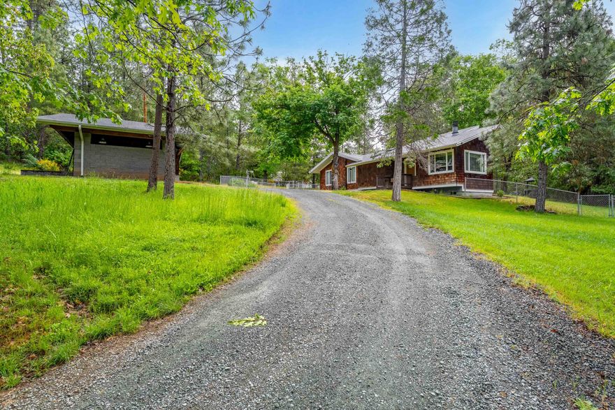 Country Living w/ European Finishes. 1,699SF 3-bedroom, 2-bath home is Quiet & Serene. A 1997 remodel updated the interior cabinets & finishes throughout w/ a design that feels current. Private driveway leads you past the fenced garden & chicken coop to the home sitting just the other side of a year-round creek. Elevated ceilings, a wood-burning fireplace, & beautiful, laminated flooring create a spacious family room. Step into the light & bright kitchen w/ Euro cabinets, solid surface counter tops, & tons of storage. The design is carried into the Laundry/Pantry room w/ a matching design. This is a cook's kitchen!! Bedrooms are off the main hallway & private. An entertainer's deck wraps half of the house & looks out over the tree-studded property & creek. Plenty of parking in a 2-car covered carport & attached garage/workshop. Lots of room for your toys, RV, or boats. Fabulous Salmon & Trout fishing just down the road, snow skiing, rafting, hunting & much more, all within a few miles