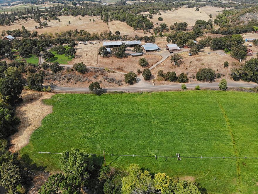 Sitting on 270+ acres, this Eagle Point ranch has plenty to offer! Perfect area for horses/cattle and close to town, this property comes with two remodeled ranch style homes, a huge covered horse arena, horse stalls, a large equipment shop, hay barn, pond with fish, private electric gate into property, neighboring BLM, and nearly 60 acres of water rights. The main home is a 3 bed 3 bath home that, offers a country kitchen that opens up to a spacious living area with open beams, a loft, and a sizable deck with incredible views of the property. The second house is cozy and eccentric with 3 bedrooms and 1.5 bath, practically brand new, with a remodeled deck overlooking beautiful mountains and is an excellent space for a tenant or caretaker. This is a fantastic ranch property with meadows, plenty of grazing capacity and plenty of miles for riding. Don't miss out on this beautiful Oregon ranch!