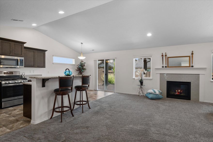 NEW PRICE in Maple Meadows! This move in ready gem is a beautiful 3 bedroom, 2 bath single level home, featuring vaulted ceilings in the great room and primary bedroom. Primary suite has two walk-in closets, plus a dual vanity and glass enclosed shower. Gorgeous, centralized kitchen with granite counters, abundant cabinetry, pantry, stainless-steel appliances plus the refrigerator is INCLUDED! Perfect for entertaining inside at the bar top island, dining area or out on the custom paver patio. Year-round outdoor living awaits, enjoy a covered patio with beautiful pavers that extend the full length of the house. Easy care xeriscape with river rock in the front and rear yards makes this home a low maintenance, lock and leave option gives you more time to enjoy the nearby Dry Canyon, Downtown Redmond or the many paths in the community and beyond. Fully fenced yard with timed sprinkler/drip system. Two car extended garage with fold down ladder to attic and door to the side yard