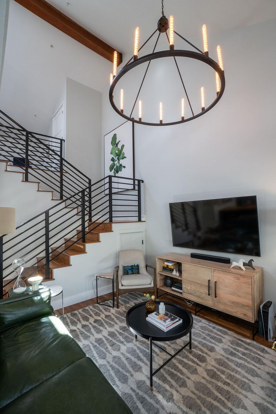 Welcome to your dream condo, a stunning blend of modern design and comfort! This fully remodeled gem boasts a spa-like primary suite on the main floor, featuring exquisite finishes and tranquility. The open-concept living area showcases beautiful wood floors that flow seamlessly into a breathtaking kitchen, complete with quartz countertops, sleek open shelving, a JennAir induction electric cook top, granite composite undermount sink, and a built-in coffee maker, complemented by a custom-paneled refrigerator & dishwasher. Upstairs, find two spacious bedrooms and a versatile loft area, perfect for work or relaxation. Step outside through the trifold panoramic glass doors to a cozy patio that embodies the indoor/outdoor lifestyle. Entertain in style with a BBQ area, and even a putting green for endless fun! This condo is the perfect retreat, offering luxurious living spaces and all the amenities you need. Don't miss your opportunity to call this extraordinary property home!