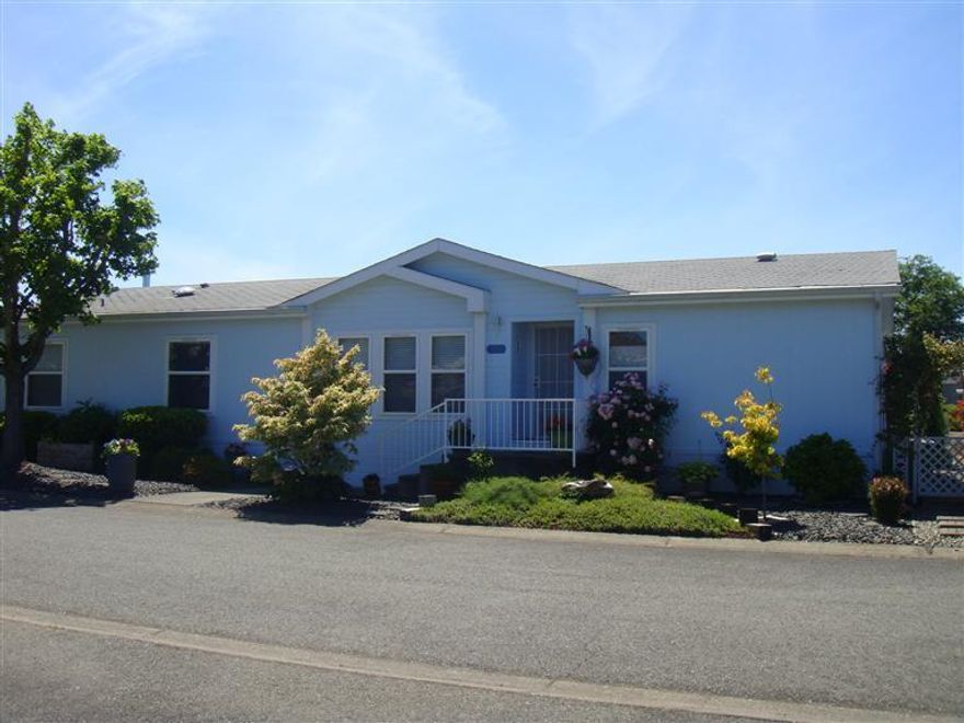 Fantastic Manufactured home with unbelievable upgrades in Willow Estates North. 1997 Palm Harbor home updated in 2010. 1792 sqft. 3 bdrm, 2bath, living room, family room and formal dining. Kitchen features upgraded cabinets, slab granite counters and kitchen nook. New floor coverings, Home is painted in custom colors. Large master with walk in closet. Master bath has it all, tub, shower and double sinks. Private patio, 8 x12 shed, colorfully landscaped, sprinkler system. RV parking available in park.