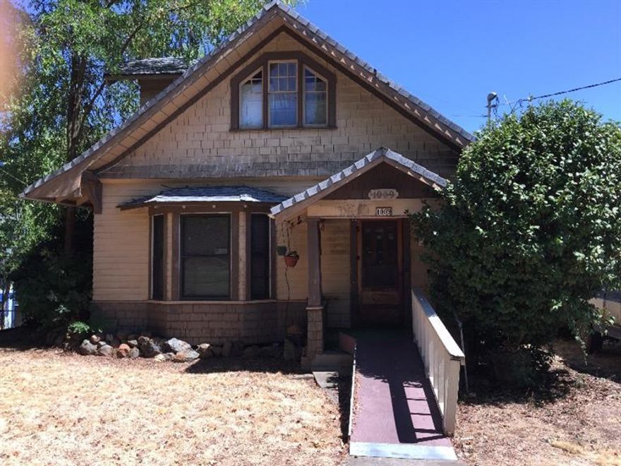 Truly a diamond in the rough! This home is ready to be transformed into the classic beauty it is meant to be! Located in a neighborhood of wonderfully revived older homes, on a wide tree lined boulevard. There is much of the original woodwork, door and window surrounds and flooring that remains in great shape. The overall condition of the home and property is well worn and in need of repair and updating but there is great potential for this to be a great restoration project. If you are more interested in just getting a great value for your investment, the home could be a good starter home or rental without a large outlay of funds. The 4 bed/1 1/2 baths and 1648 square feet offer plenty of room and the lot is a large .19 acre space. There is also a big daylight basement and several outbuildings and a large garden shed.
