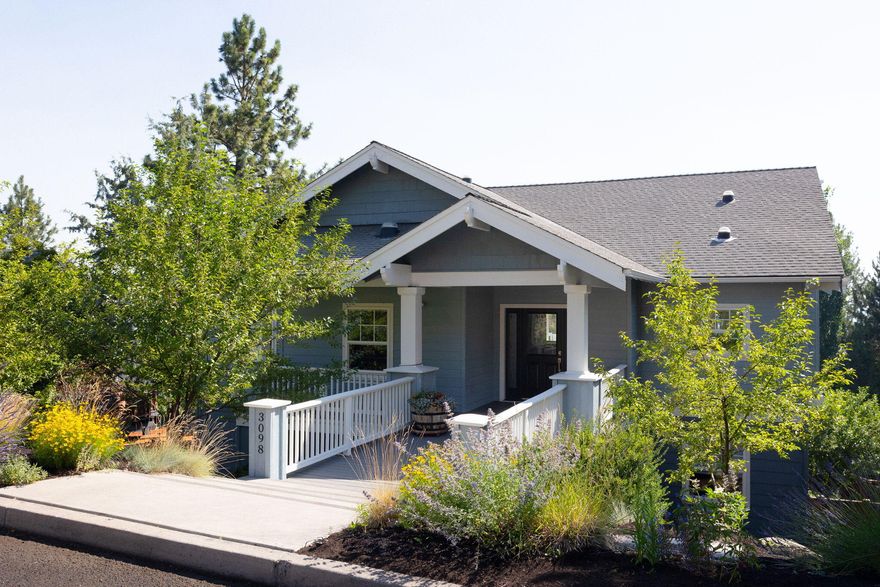 Stunning easterly views—including iconic Smith Rock—await in this beautifully updated home in Awbrey Village. A flat entrance bridge provides easy access to the main level, featuring a spacious primary suite, office, kitchen, dining area, second bedroom, and full bath. Large windows and an open layout fill the space with natural light, while the oversized deck offers panoramic views—perfect for entertaining.

A convenient laundry chute connects to the lower-level laundry. Downstairs, you'll find a generous bonus/flex room with a wet bar, guest bath, two additional bedrooms, and a separate entrance with a private deck—ideal for guest quarters or multi-generational living. The three-car garage includes a gym space and abundant storage for all your Central Oregon gear.
The fully fenced backyard boasts an electric gate and irrigated garden beds—all just minutes from river trails, parks, downtown Bend, and with easy access to Mt. Bachelor and the Cascade Lakes.
