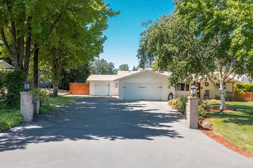 Enjoy Grants Pass the way it was meant to be enjoyed with this completely remodeled, updated home on a .53 acre lot.  Experience the best of both worlds with fresh well water, deeded river access, and city sewer, as well as District 7 Schools.  This GPID-irrigated property has room for the hobby farm feel while being close to city services.  The well designed home has generously sized living and dining rooms and boasts a fully remodeled kitchen that features quartz countertops, six-burner gas stove, hammered copper sink, and wet bar with built-in wine fridge.  Attached two car garage along with attached single car shop with guest room is a wonderful compliment to this beautiful, easy living home.  Backyard is fully fenced and cross-fenced with an adorable playhouse style cottage.  Come check out this truly unique property for yourself!