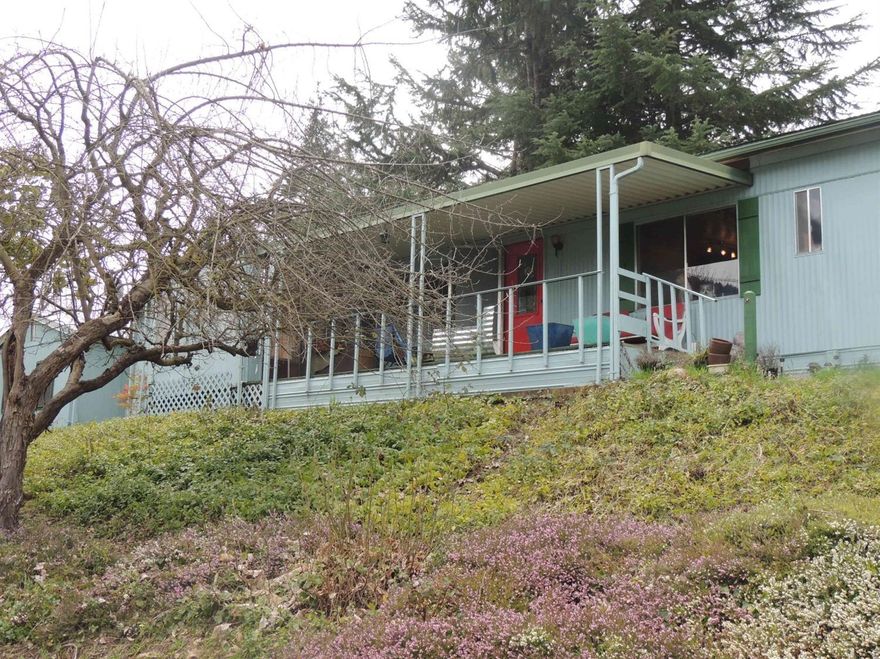 Cute mobile home screaming with personality. Located in the desirable Fruitdale area. Would make a great rental for the investor or a cozy home for a couple. Non-conforming shop 10x16, carport, outdoor kitchen- beautiful views. Close to great walking trails. MOTIVATOR SELLER- MAKE AN OFFER!!