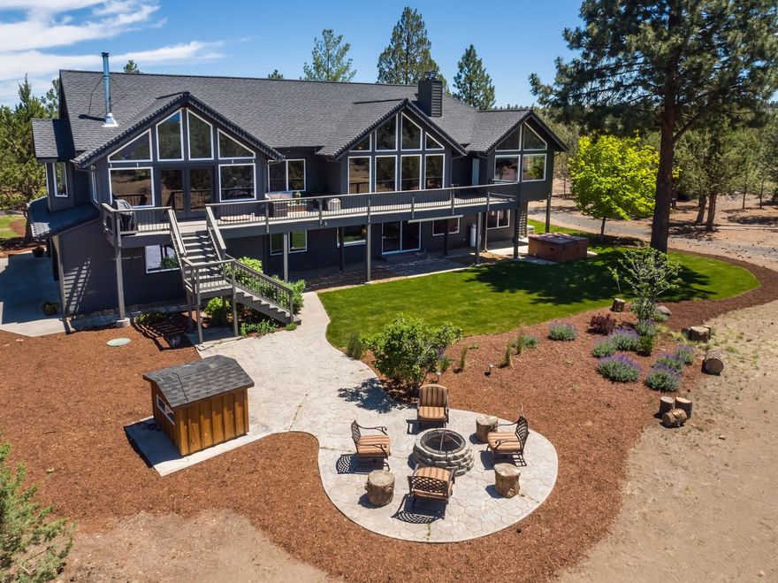 LOCATION, PANORAMIC MOUNTAIN VIEWS, PRIVACY and ACREAGE, this executive style home on 24 acres location between Bend and Sisters checks all the boxes! Newly paved driveway bring you into privacy with extensive cascade mountain panoramic views.  This home is engineered and designed with highest quality to captivate views from all living spaces, w/privacy from mature trees surrounding the property. Floorplan flows with extreme livability for entertaining inside or out. Features include radiant floor heating in all bathrooms, Chef's kitchen, top of the line appliances, 2 kitchen sinks, knotty alder cabinets, granite & quartz countertops.  Beautiful hardwoods and slate tile throughout living spaces. 
Brand new HVAC system. 4'000+-Sq.Ft. finished shop, sheet rocked, insulated, and heated w/12' roll up doors, 4 refreshed rooms, laundry & full bath.  Multiple additional outbuildings with roll up doors for added garage space/storage. Sisters Schools, Super Location, Exquisite Home.