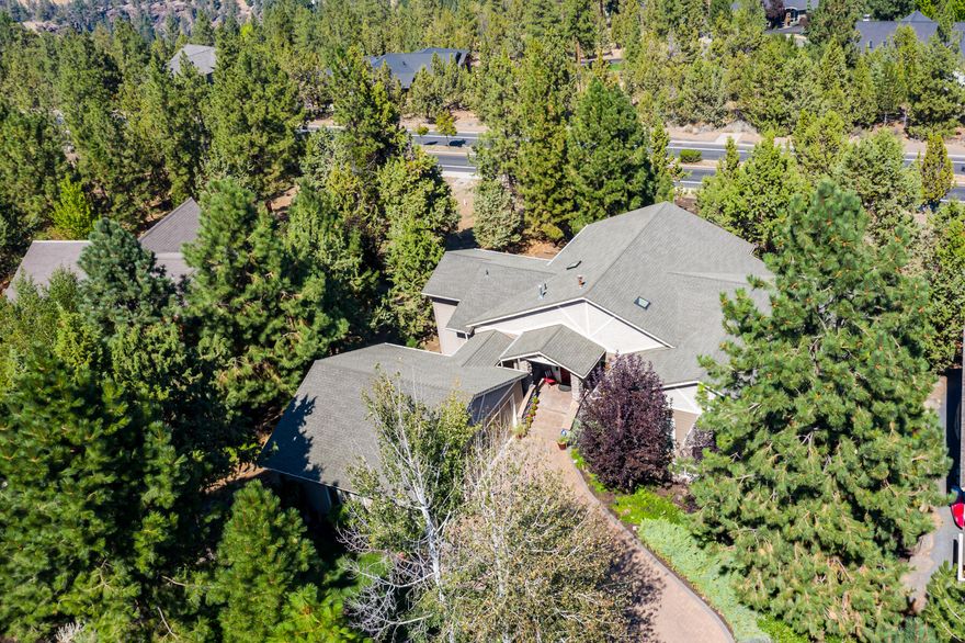 Situated on a sizeable, beautifully landscaped lot in highly-coveted Awbrey Butte, this exceptional home offers premier Bend living with Cascade Mountain views. On the main level, enjoy a thoughtful, open floorplan with panoramic easterly views and abundant natural light from 14' picture windows. The primary suite features a gas fireplace, direct access to the back deck, and a spacious bath with jetted tub. Multiple levels of expansive trex decking provide the perfect setting for evening meals or entertaining guests. On the lower level, 1,600 additional square feet offer a myriad of lifestyle options, including multi-generational living, with a large living area with gas fireplace, dining area, wet bar with extensive storage, two suites boasting full baths, a third bedroom/office, and access to a generous paver patio. Additional features include new exterior paint, dual hot water heaters with instant hot water, extensive storage, and a triple car garage.