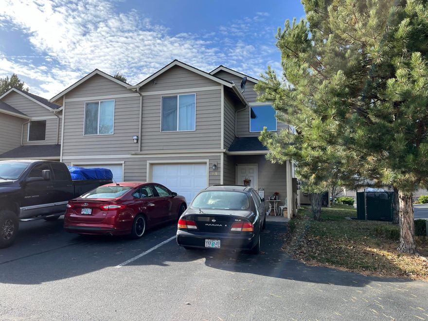 Attn Investors or first time home buyers!! Great value for this 2 bedroom plus office, two story condo unit with single car attached garage.  Corner unit. Main level features kitchen, dining, living room, and half bath.  Bedrooms and office are upstairs.  Spacious master with large walk in closet and 5 ft shower. Laundry closet is conveniently located upstairs with the bedrooms.  The home is in need of carpet replacement and fresh interior paint.  HOA includes sewer, water, garbage, snow removal, and exterior maintenance.  Location  in SW Redmond makes it easy to get around Central Oregon.  City park across the street from the complex!