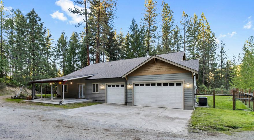 This custom ranch-style home features 4 bedrooms, 2 baths, ~2,753 sq ft of living space, and sits on ~9.16 wooded acres. Highlights include vaulted ceilings, skylights, custom cabinetry with granite countertops, double ovens, a cozy wood stove, a finished 3-car garage, fenced backyard and garden, and RV parking. This is a short sale — the lender already has the appraisal in hand, which may help streamline approval. Home offered as-is. All terms subject to lender approval. Showings by appointment.