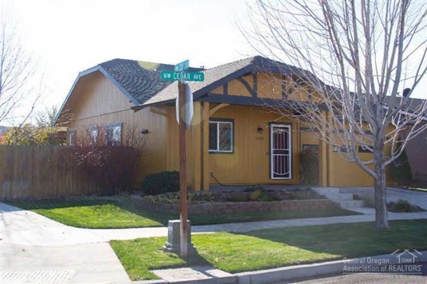 Well maintained home on a corner lot. This lovely home boasts mature landscaping with a beautiful perennial garden in the warmer months, private back yard with pergola, bright open floor plan, spacious tile countered kitchen, large utility room, new commercial grade laminate floors throughout, new exterior paint, AC. Convenient location close to shopping, dog park, community park and schools. Community RV storage available for a fee.