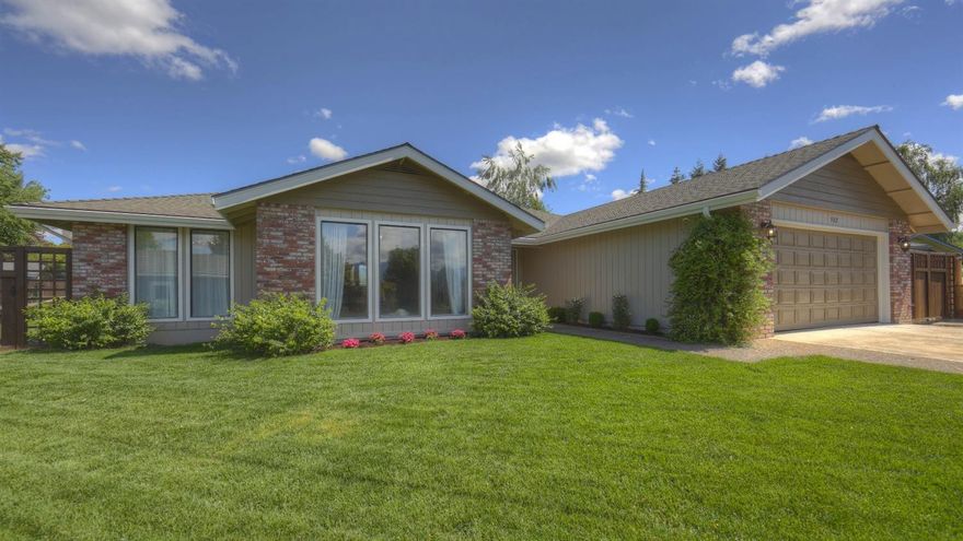 This spacious ranch style home sits at the top of a cul-de-sac with spectacular mountain views. Step into the large entry and you're immediately wowed by the vaulted, beamed ceiling in the front room. With floor to ceiling windows, plenty of sunlight gives this house a bright airy feel. Enjoy an open floor plan, as the newly remodeled kitchen, complete with quartz countertops, marble backsplash and an apron sink, overlook the family room. A gas insert fireplace creates a cozy space for family time. There are new hardwood floors and fixtures, throughout. Down the hallway, all the abundantly large rooms, with solid core doors won't disappoint. The master bedroom feels like a retreat, with its own back patio for sipping morning coffee. The .3 acre property provides an exceptionally large landscaped back yard with in-ground sprinklers, plenty of room for gardening, throwing a ball, or just relaxing on the covered back patio. Location is prime, in the top notch school district.