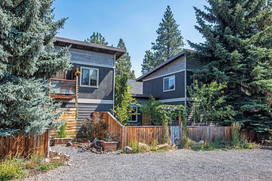 In Town Living at it's Best.  Built with Green in mind. The main house is 1285 sqft 3 bed 2 bath and built using staggered stud exterior wall construction providing ample insulation keeping this home warm in the Winters and cool in the Summers. This super cute home has a modern feel with wood grain vinyl floors, hard surface countertops, and stainless steel appliances.  The 520 sqft. 1 bed 1 bath, ADU above the detached garage, is a perfect place for a home office/studio, or to be used as a short term rental. Paver patio between main house and garage is a great place for outside dinning and relaxing.  Mature trees and other vegetation provide privacy and shade and a few other great places to relax.  This property has been grandfather in with the cities short term rental permit and allows for income potential.