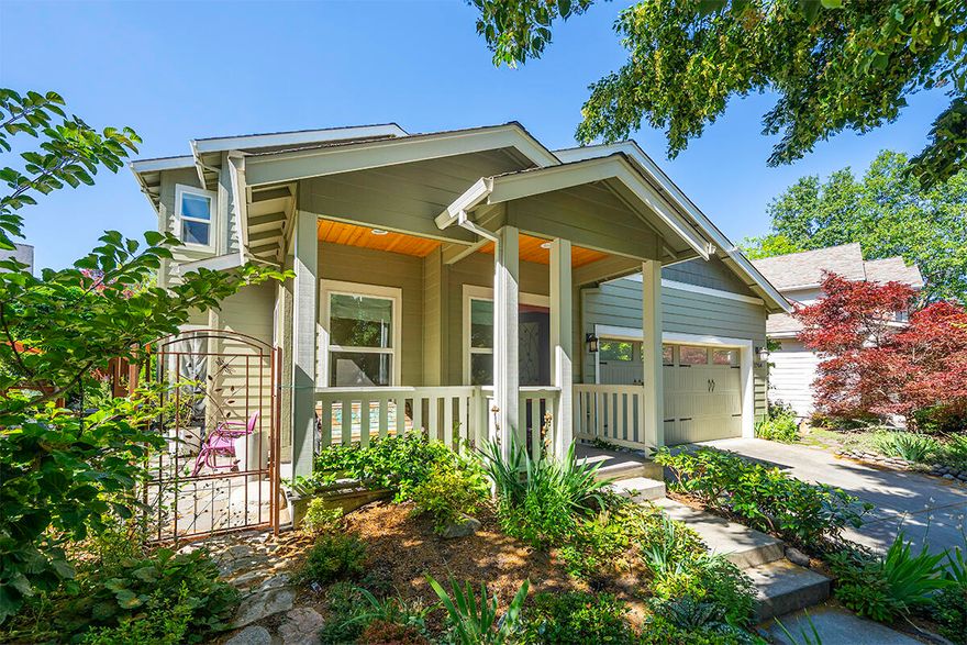 Prime location in highly desirable Clay Creek Gardens, this 4-bedroom Earth Advantage home offers refined living with exceptional craftsmanship & designer finishes. Abundance of upscale upgrades throughout, full amenity list available. Covered front porch leads to Travertine entry with sunny morning reading area. The floorplan opens to the expansive open-concept main living area with solid hardwood flooring, stacked stone gas fireplace, built-in custom desk, open dining & fabulous chef's kitchen boasting GE Café Series appliances, gorgeous granite slab with raw edging, cherry cabinets & dining bar. Primary suite on main level with private patio, luxurious bath with in-floor heating, soaking tub & large slate tiled shower. Laundry room & half bath. Upper-level family room, plus 3 bedrooms & full bath. The professionally landscaped grounds are an oasis of privacy with peaceful water feature, lush plantings, multiple patios & custom gate. Adjacent to open space. Double garage.