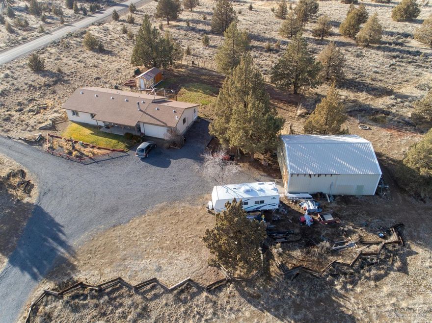 New Price has potential for your own personal updates. Hard to find Home in the beginning of Crooked River Ranch. Close to town only 9 Miles from Redmond, Level corner acreage with TONS of Potential. Nice one level home with functional floor plan. 30x36 Pole barn Shop has Concrete floor and 50 Amp power. Large well built greenhouse. Spacious family room, Garage converted and finished. Additional storage room added. Heat pump. Newer vinyl windows. wood stove. Private Well. Hard to find affordable stick built home in the country with room to bring all your toys and animals.Cascade Mountain Views!