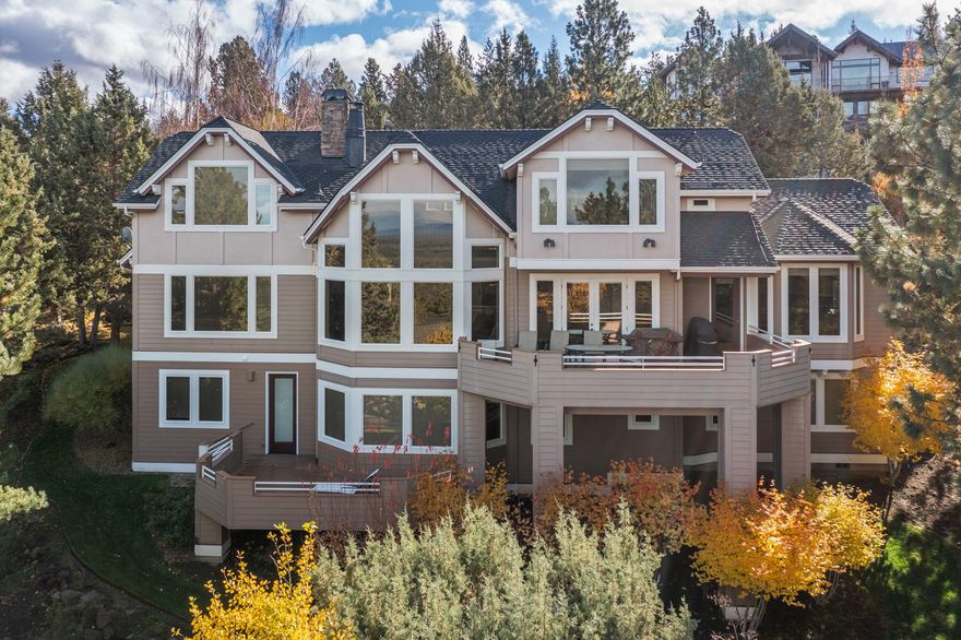 Located on highly-coveted Starview Drive on Awbrey Butte, this stunning home offers premium
finishes with panoramic Cascade Mountain views. Special touches include Brazilian Cherry
hardwood flooring, coffered ceilings in the kitchen and formal dining area, and extensive crown
molding and stonework throughout. In the living room, vaulted ceilings and floor-to-ceiling
windows let in abundant light and afford breathtaking mountain views. Enjoy a gourmet kitchen
with multiple pantries and high-end appliances including a Sub Zero refrigerator, Dacor 5-burner
cooktop, and Wolf microwave, wall oven, and warming drawer. The primary suite offers a jetted
tub, heated tile floors, and a spacious closet with built-ins. Soak in the incredible views from
multiple decks with Trex decking on the upper and lower floors. Additional features include a
theater room, spacious upstairs office with mountain views and custom built-ins, a downstairs
living area with gas fireplace, and generous storage space.