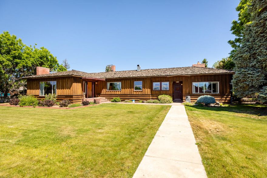 Custom home. This home is ready for you. It has 3 bedrooms, 1 bath, wood work, built-ins, a large dining room, a large formal living room with an out side entrance, coved ceilings and a gas insert fireplace. In addition, there is a cozy family room with a gas insert fireplace, brick work, and a built-in Jenn-air unit. 
Out side is a covered patio that links the family room to the two car garage which also has a studio apartment unit with it's own entrance. There is also another finished building that would make an excellent office, craft room music room etc.
The land scaping is very private and appealing.
This home is located in a small agricultural area town and is only about a 3rd of a mile from the Malin Park which has all the features of a great park plus an olympic size pool. The home is also very close to the Lava Beds National Park and just 84 miles from Crater Lake National Park. Outdoor activities of many kinds are not far away.