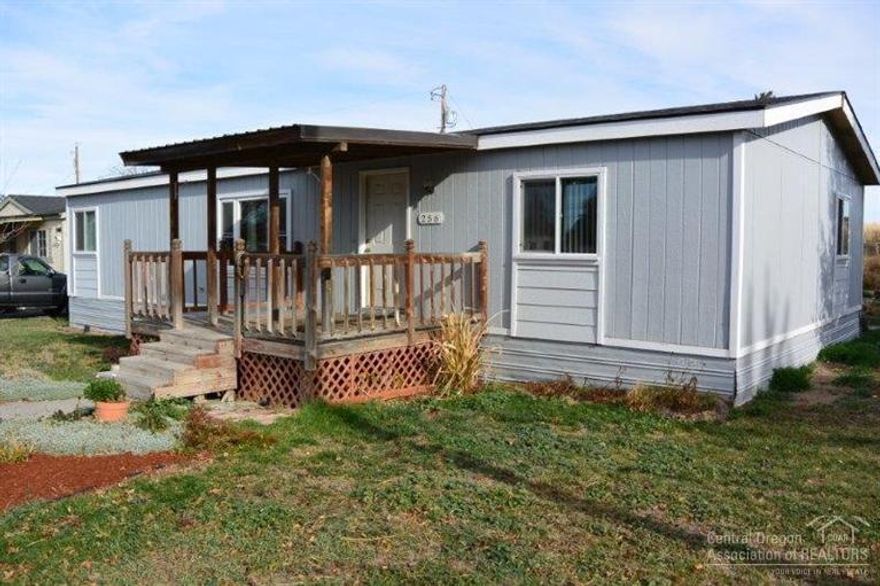 1991 manufactured home on .2 acre lot in Southeast Redmond. Master bedroom is separate from the other bedrooms. Kitchen with eating bar and pantry. New carpet, windows and interior paint. Newer roof. Forced air heat. Enjoy the covered back deck with bench seating. Very usable lot with green house, raised beds. Room for RV parking.