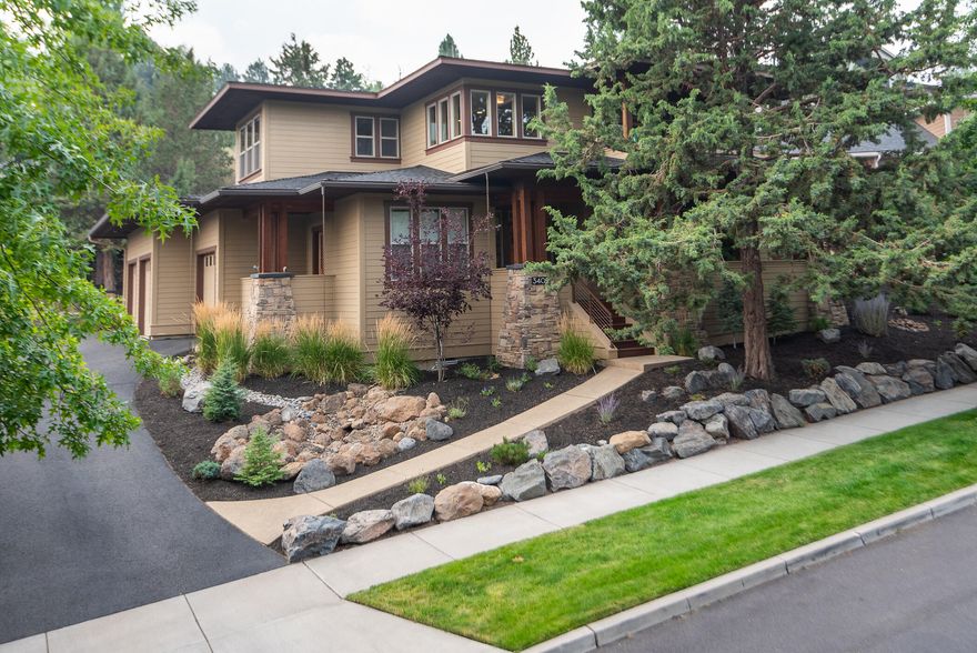 This gorgeous Awbrey Park home is in a perfect location in a quiet, tree-lined West side community near parks and trails. Spend weekends & evenings in the backyard putting green / sports court for pickle ball or mini hoops, or stay inside for movie nights with the drop-down 112'' projection screen. The large great room with refinished hardwood flooring is ideal for entertaining, with bar seating in the kitchen, a welcoming kitchen island and an extended outdoor patio. The main floor bedroom could also be a home office. Upstairs, discover a bonus room, 2 addl. bedrooms & spacious primary suite which boasts a gas fireplace, private balcony with Pilot Butte vistas, an impressive walk-in closet, and a lavish bath with jetted tub, walk-in shower & double vanities. Plenty of room in the 3-car garage for extra storage & a workshop too. The friendly Bend neighborhood is idyllic, with a playground, picnic tables, a park and trailhead leading to beautiful walks along the river.