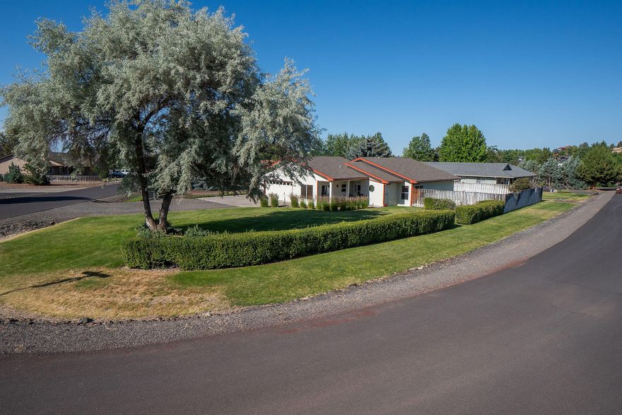 Price Reduced! This charming home is in a prime location with lovely views of Barnes Butte & unique rock formations. The open floor plan seamlessly flows into a spacious great room with a cozy propane stove & mini-split system for efficient A/C & heating, high, vaulted ceilings, & plenty of natural light. The well-equipped eat-in kitchen boasts SS appliances, tile floors & counters. The primary suite offers a peaceful retreat with tile counters, floors & tub/shower combo, plus dual showerheads. Across the hall from the 2 guest rooms is the guest bath with a new shower enclosure, tile floors & counters & a hand-held showerhead. Enjoy relaxing or entertaining guests on your front porch or in your private backyard, with mature landscaping, a drip system, & deck. The front & side yards have automatic sprinklers to keep them lush & green. The yard is fenced, has a concrete RV pad, storage shed, exterior security camera, & a New Roof! Call for your showing today!