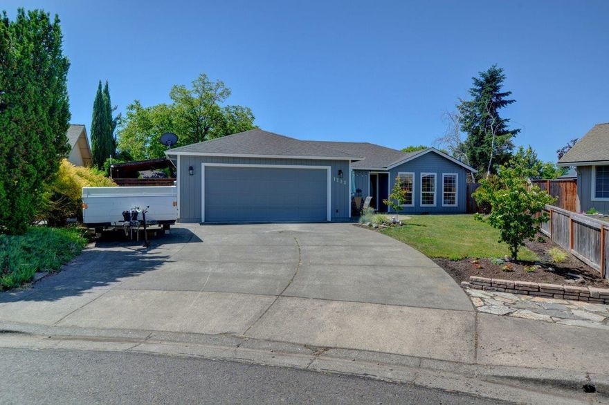 This beautifully updated 3 bed/2 bath home in a private cul-de-sac has so much to offer! Inside, natural light is abundant, and the completely remodeled kitchen is a baker's dream, with a double oven, oversized induction cooktop, two pantry spaces, and space for 2 refrigerators! There is a newly added dining/office area, the bathrooms have been updated, fresh paint in the primary bedroom, a separate laundry room, coffered ceilings in the living room and primary suite. Outside is complete with a large deck, pergola, patio, fire pit, shed, and chicken coop. There is plenty of room for a garden, and a pool if desired. Parking is plenty with an extended 2-car garage, an attached carport, and RV parking.  Desirable location, close to all amenities in the valley. Schedule a tour today!