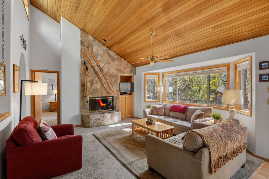 Sunriver retreat in a prime location - just across the street from National Forest land and the trails to Benham Falls, and minutes from the river! This 3-bedroom home (with 2 en-suites - one on each level) and 2.5 baths offers an open, vaulted great room with abundant natural light, perfect for gathering after a day of adventure. Extensive updates completed in 2025 include a brand-new roof, fresh exterior paint, new front steps, and sleek modern deck railings in the front and back & freshly stained rear decks.  Recent interior upgrades include new carpet, a downstairs sectional, and refreshed upstairs furnishings. Sold fully furnished and equipped with A/C, this home is ready for year-round enjoyment. Relax in the private hot tub or explore Sunriver's miles of bike paths and resort amenities nearby. Ideal as a full-time residence, vacation getaway, or rental investment!