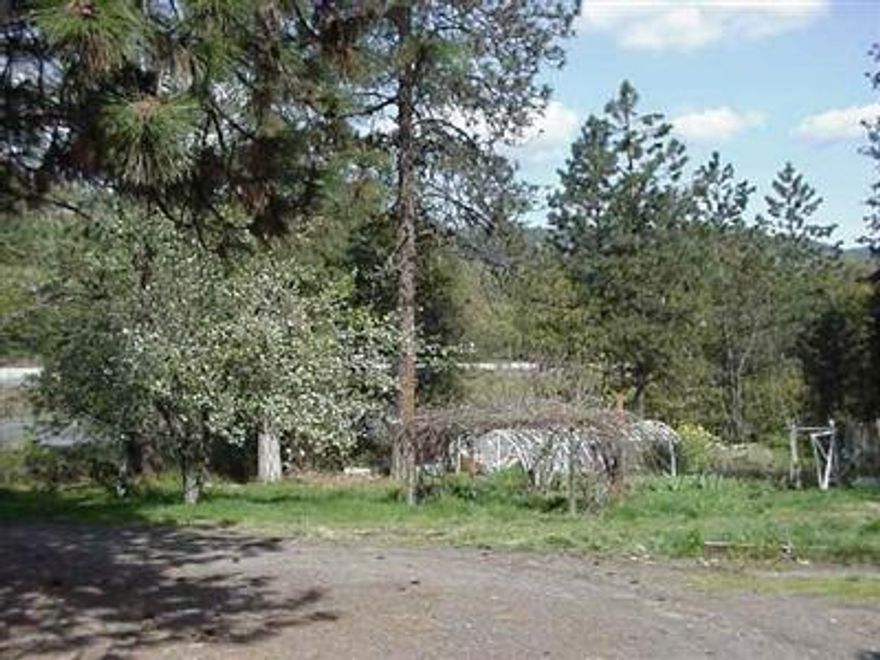 Improvements Sold as Is Only. 1 Acre Bldg Site Near City Unit. Trees W/Meadows & Garden Area (Est). 924 Sq. Ft. Mobile And 2 Buildings + Storage Shed. (2 Nice Newer Homes On 3 Sides).