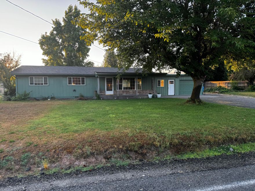 This lovely country home sits on .33 acres. The very comfortable 3 BR/1.5 BA home has absorbed one of the 2 garage spaces into living space.