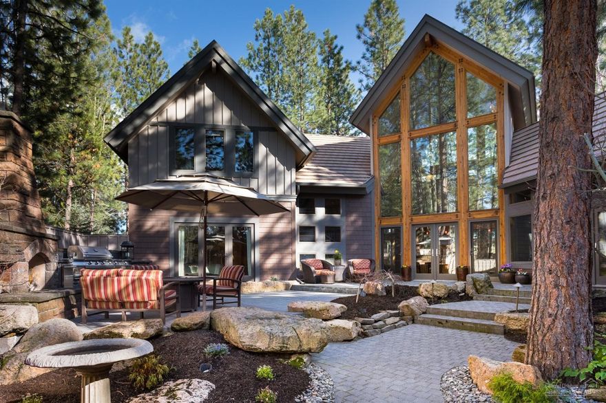 Nestled above Broken Top's Signature Fairway, this spectacular home is a sophisticated blend of NW & Contemporary custom architecture that surrounds you in luxury from every angle, yet allows you to live in a casual environment. Custom wood-carved Cougar entry gate open to 1600/sq.ft. outdoor living paradise featuring private courtyard, gas fireplace, BBQ and refrigerator. This home features incredible flowing floorplan, spacious open living with Gourmet Island kitchen/Jenn-Aire and sub-zero appliances, stunning radiant heated Indiana Limestone Floors/staircase, vaulted beamed ceilings in every room with wood-case Andersen windows throughout strategically placed with french doors that bring the outdoors in. Private Master-suite retreat & loft/office/den, formal dining and 2 bonus rooms would be ideal theater or guest suite. Very private lot with a natural blend of outdoor and indoor living. Attached and detached garages offer 4-car garage w/flex space/bonus room above.