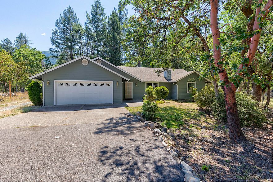 The simplicity of country living is found right here! This serene property offers a private setting, low maintenance yard, shade trees and a year-round creek flowing through the backyard. The home is a spacious 3 bedroom, 2 bath with a split floor plan. Master bedroom is large with an en suite bathroom and walk in closet. Cozy living room features a nice woodstove and vaulted ceiling. Wonderful kitchen with stainless steel appliances boasts lots of cabinets for plenty of storage. Property also has a garden area, workshop and is fenced and gated. Take a tour... This gem is move-in ready!