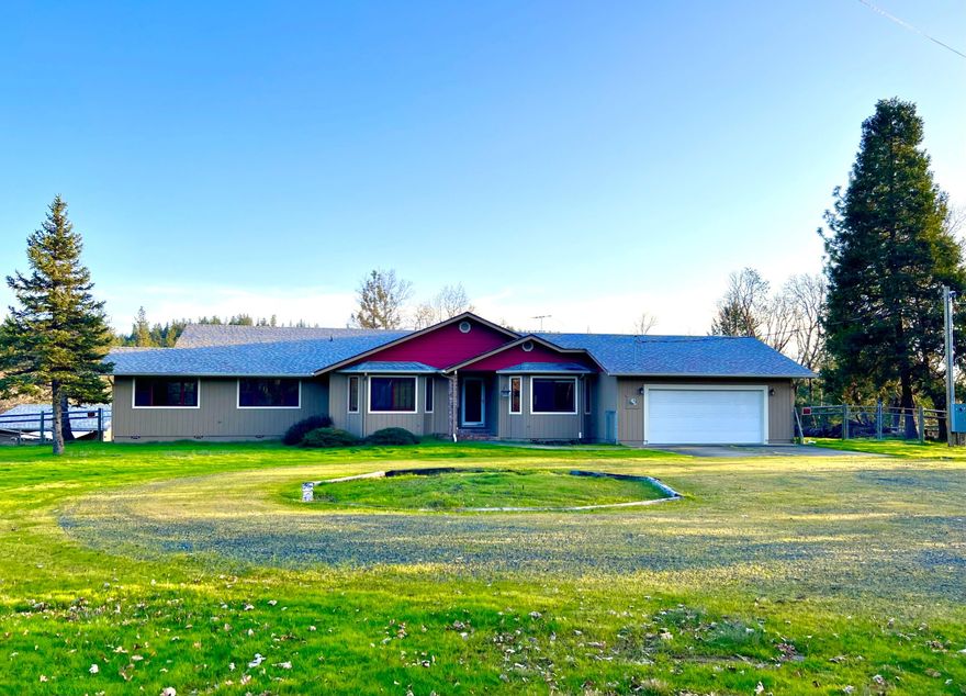 Peaceful and idyllic! This Pacific Northwest ranch style home sits in a beautiful meadow inside a treed 6.48 acres country setting with its own private driveway.  The single-level 2,646 sq.ft dwelling features a spacious living room with vaulted ceilings, an elegantly designed kitchen, a primary bedroom with a large bathroom and a walk-in closet, and an attached 2-car garage.  The house has a total of 3 bedrooms plus a bonus room that can be used as an office, library, studio or more.  The wrap around deck can be accessed from the living room, primary room, and the rear end of the house; you can relax while entertaining yourself and your guests with a lovely mountain view from the deck.  There is also a detached 576 sq.ft garage/shop.  The circular driveway in front of the house was designed for easy in-and-out access.  There is plenty of space for RV parking.  Several areas are great for gardening. Don't miss this opportunity to own your dream Oregon country home.