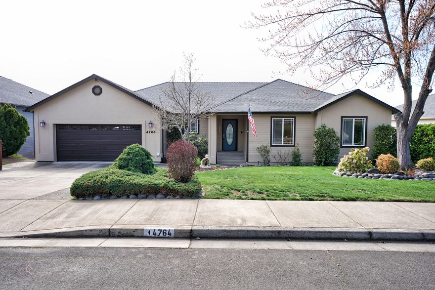 Lovely and well-maintained 5 bedroom 3 bath home with amazing views of mountains & city! Spacious,  well laid out kitchen w/granite countertops, beautiful cabinetry & SS appliances. Living Room with 3-sided gas fireplace, trayed ceiling & ceiling fan. Hardwood, tile,  laminate flooring & carpet through-out. Upstairs is the primary bedroom featuring a slider to deck, bathroom with double sinks, water closet, tile shower & walk-in closet. There are 2 more nice sized bedrooms and  laundry room w/tile floor & counter. Relax & enjoy the views from the upstairs deck featuring a retractable awning, ceiling fan & gas BBQ hookup. Downstairs offers a family room, wet bar, gym area, craft room, workshop, plenty of storage, 2 more bedrooms & full bath w/double sinks & tile bath surround. Exit to patio w/hot tub, pergola, water feature, ceiling fan, lighting & terraced lawns. Possible 2 family set-up. Each level has separate gas heat & A/C. One Seller is Licensed Real Estate Broker in Oregon