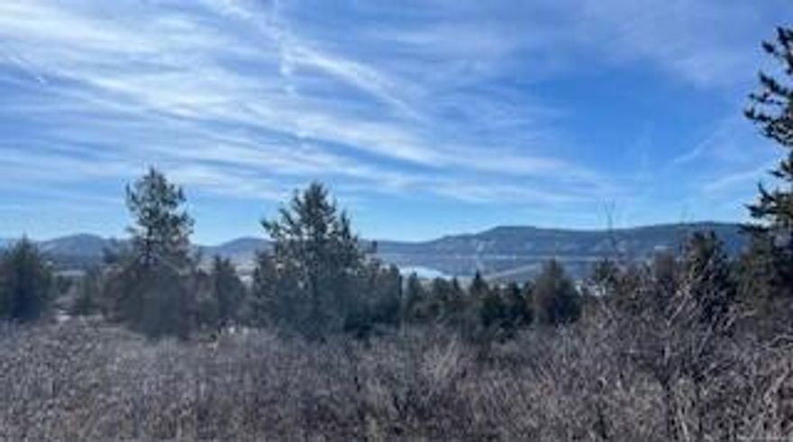 Enjoy the expansive views of mountains and fields from this beautiful lot at the Running Y Ranch Resort.  When not enjoying the peaceful setting and views from your deck, you can enjoy all the amenities the Running Y has to offer including paved walked trails, access to the Sports and Fitness Center (indoor pool, hot tub, sauna, weight room, activities room), pickleball and tennis courts, and playground. BONUS:  Seller has agreed to gift to Buyer, 2244 sq ft architectural floor plans and topography report.