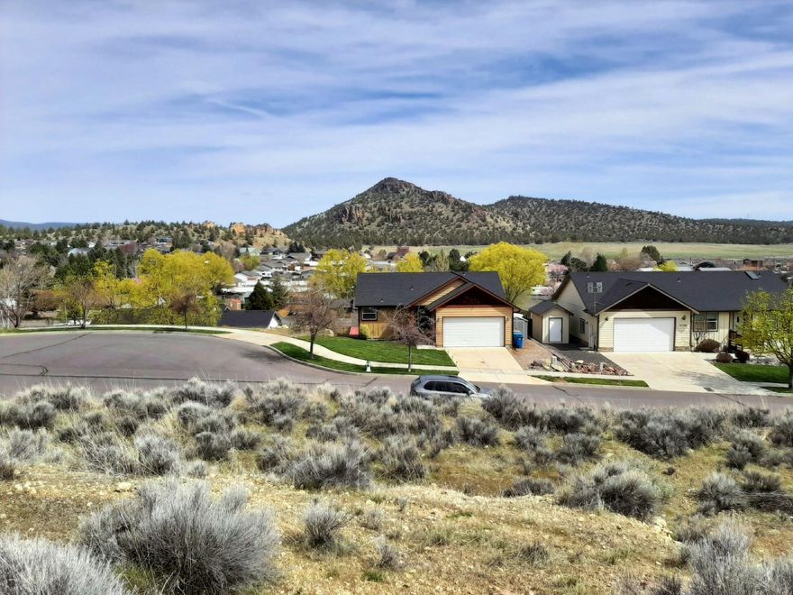 1 acre in town! Could be 4 lots. Power at the lots, city water and sewer available according to the planning department. At the end of Bobbi Court - a neighborhood of very nice homes on a quiet cul-de-sac. Potentially outstanding views of Barnes Butte depending on home placement. Just minutes away from shopping, dining, and recreation, this is a really desirable place to build a home OR a few homes. Attention builders and investors! Owner is open to looking at owner carry financing. Great opportunity - come take a look!