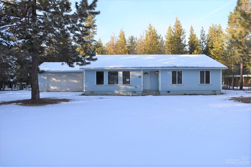 Single level home home in Tall Pines Subdivision. Newer flooring, laundry & pantry with barn wood doors. Eat In kitchen opens to dining area and living room brightened by multiple windows overlooking the front yard. Almost an acre lot with low maintenance landscaping provides room for possible Shop, RV parking & Toys.