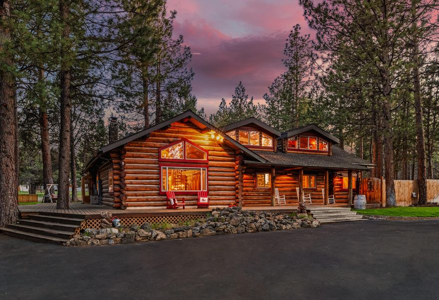 One of the most unique and enchanting properties in all of Central Oregon. At nearly 4300 sq ft, featuring four bedrooms and four bathrooms plus a flex room, living room, dining room and an incredible bonus room with a custom ''NW Tiki bar.'' Perfect for entertaining any number of guests, both inside & out. The home is nestled at the center of a nearly 2 1/2 acre, flat, wooded lot in the popular Saddleback neighborhood just west of the city limits. Minutes from beautiful Shevlin Park and Phils Trail. Also near schools, shopping and restaurants. This home is a dream. Amenities include an expansive wraparound deck, shop/garage space totaling nearly 1800 ft.² that can easily accommodate one or more sprinter vans or RV. Numerous other outbuildings, 220 V hot tub hook up, zip line, fire pit, fireplace, wood stove and RV parking. A rare opportunity to own a home that has only been up for sale one other time in the last four decades! Affectionately dubbed the log Mahal by the current owners!