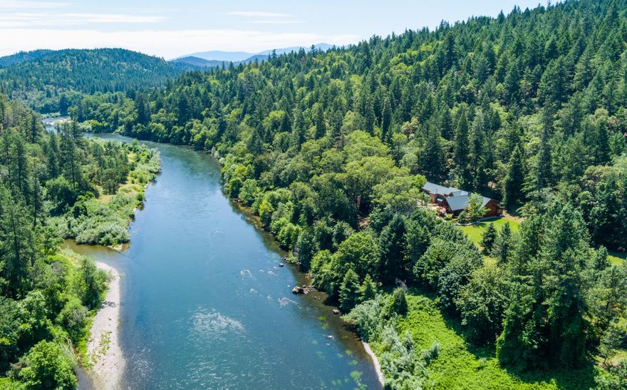 Exceptional Southern Oregon River Front Property. 1,649' of private river view frontage to the fabulous ''Wild & Scenic'' Rogue River. Gorgeous, high-quality lodge style 5-bedroom, 5 full bath luxury Homestead log home. Plus, 1,512', 2 bedrooms, 2 bath detached living space. World-Class Estate on 15.20 park-like acres w/end of road gated privacy & peaceful setting that will energize your soul. Expansive lawn, mature shade trees, fenced garden/orchard, greenhouse, chicken-coop, 2-story play-structure & shaded river views for entertaining friends/family. This unique opportunity has access to world-famous fishing, hunting, rafting, & adventure hiking, yet only minutes to shopping/medical. Designed to bring nature inside, this custom log home w/views from every room, truly is lodge style living w/3 separate vaulted bedroom suites w/private balconies, expansive dining area, grand living rm, spacious family rm, sunroom/enclosed patio, gorgeous kitchen w/breakfast bar & walk-in pantry.