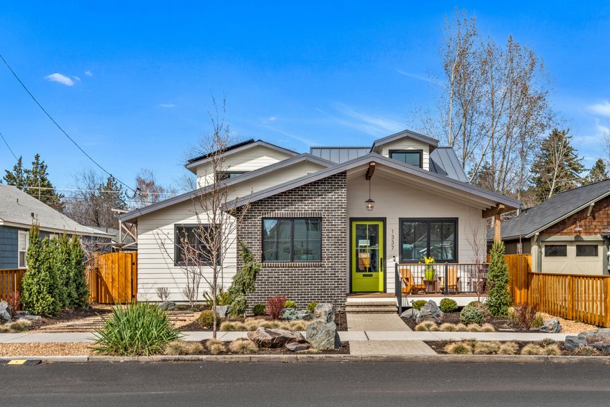 Located in the heart of Westside Bend, one block from the Deschutes River and the pedestrian bridge to Drake Park and downtown, this custom home, completed in 2023, captures abundant natural light with its open floor plan. An ideal basecamp for adventure enthusiasts and social gatherings, featuring spacious guest quarters with a kitchen, full bath, and laundry—approved as a separate ADU. Designer touches include high-end lighting, a custom gas fireplace, hardwood floors, window treatments, dormer windows, Sonos speakers, kitchen with a large island, bathroom heated radiant floor and custom cabinetry. The outdoor space is perfect for entertaining, complete with a firepit and Arctic Spa. The finished garage provides ample space for adventure gear, including a van camper with an 11-foot door.  Designed for energy efficiency, this home includes solar panels, exceptional insulation, and an on-demand water heater. Experience how this remarkable home can make your next adventure a reality!