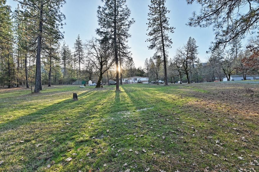 Are you looking for a piece of land to create your own small farm? 2.53 acres located in rural Rogue River, property offers flat useable land, well, septic and power are already there!!   Live in the current mobile home while you build your future!!  Don't miss this opportunity at a great price!