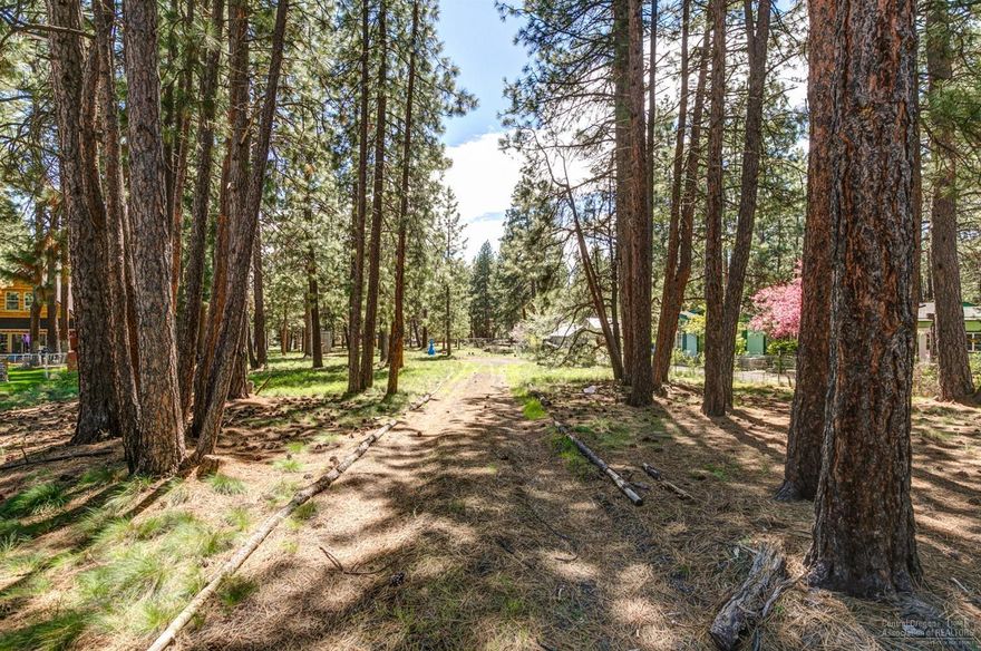 Ready to build lot in beautiful SW Bend! Conveniently located just minutes from the Deschutes River & the Old Mill District, this building site is a unique opportunity. Cascade lakes, Mt. Bachelor, hiking, fishing & other recreation are all nearby. Lot was selectively cleared for privacy & complete with full RV hookups, standard septic, power & Agate water in place for a single family residence. Bring your builder & create your own dreams, or enjoy making family campsite memories here! Already set up with full RV hookups w/easy access. Perfect site for your home, shop & all your toys, horses too. Storage shed included & on a paved road - don't miss!