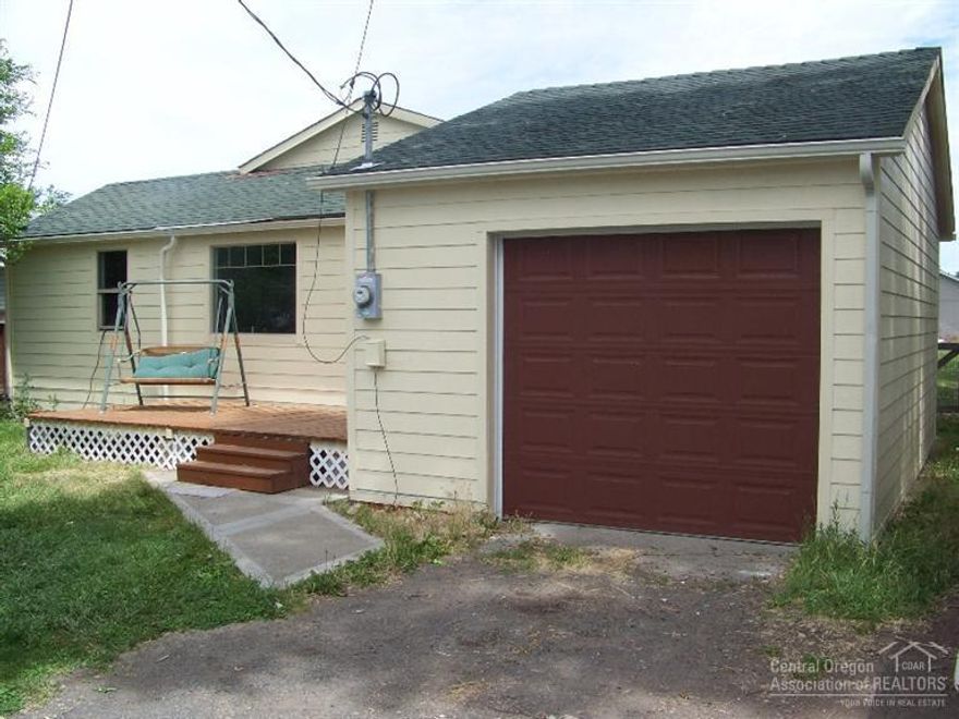 Seller has totally remodeled this home including the following: new plumbing, new electrical and service, tankless hot water system, new vinyl windows and energy efficient exterior doors, new insulation, new siding, new cabinets in the kitchen, repainted and the list goes on. This home is completely energy efficient. Home could easily rent for over $750 per month. Very big lot with access along the south side of the home. zoned to accommodate an additional dwelling.