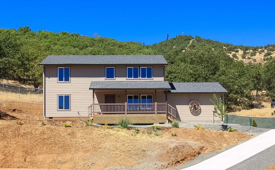 This is a great opportunity to own a brand new home for under $130 per Sq. Ft. This 4 bedroom 3 bath home sits up high so you can take in the views of the surrounding mountains and valley. Located in Gold Hills newest subdivision this Light and bright home with the master bedroom including large bathroom and a spacious walk in closet is on the first floor plus a large living room, great kitchen with plenty of cabinetry and nice sized dining area. The second floor has a bonus family room plus three nice sized bedrooms and a full bathroom. The indoor laundry room is large and could accommodate additional cabinetry. There is an attached 2 car garage, a deck on the front to enjoy the views from this .16 acre lot. The property is located just minutes from downtown Gold Hill, the famous Rogue River, Interstate 5 and only 15 - 20 minutes from Medford or Grants Pass. Call for your tour today.
