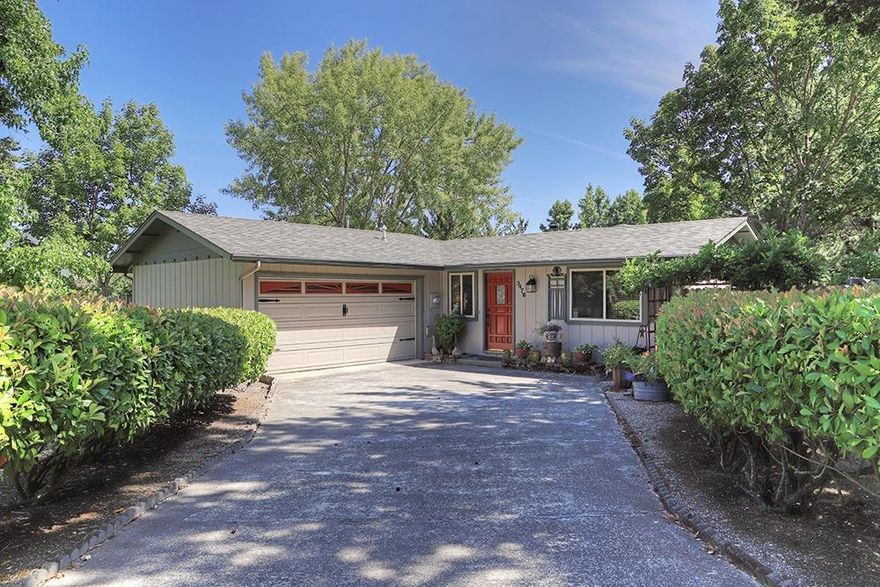 Charm reigns supreme in this lovely cottage on a private lane in a desirable NW Grants Pass neighborhood. At 942 sq/ft, and two bedrooms with a bath and a half, it's chock full of tasteful upgrades and has been meticulously maintained. Cozy and inviting with a woodstove to warm your toes, an expansive master bedroom to die for and a covered back porch where there's room to entertain, relax in the hot tub or curl up with a glass of wine and enjoy the fabulous low-maintenance backyard. Other amenities include gas heat and a finished garage with a work bench and plenty of storage cabinets. What a wonderful way to simply your life!