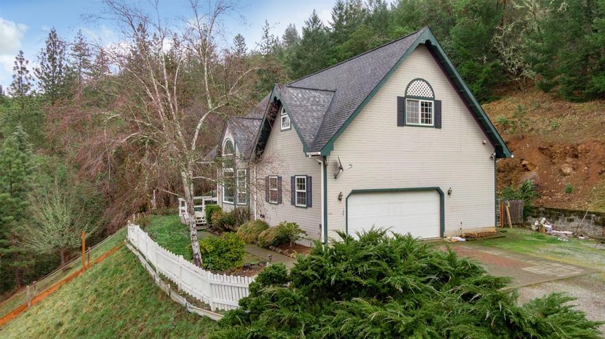 Custom built 2 story home within walking distance to downtown Jacksonville. Perched high above the city, this 3 bed 3 bath home on nearly 2 acres is ready for the next owners personal touch. Large cathedral ceilings along with large master suite, 2 additional bedrooms, large rec room and all city utilities makes this perfect for the family breaking into the Jacksonville market. Within walking distance to Britt Festival, outdoor trail systems, and all that Jvill has to offer. Very private setting with amazing valley views and priced well below current assessed value (RMV).