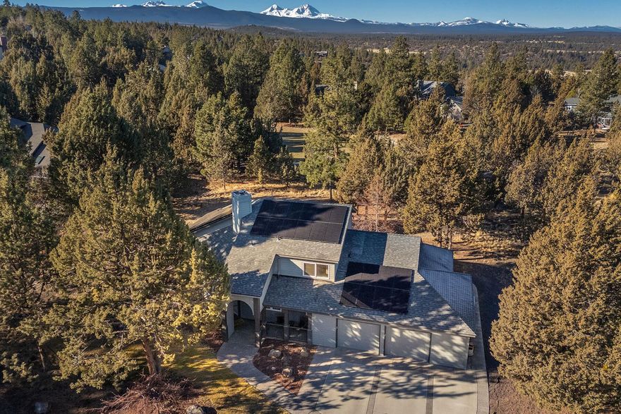 Discover this impeccably maintained home in the desirable Wyndemere community in NW Bend! Situated on a private, low-maintenance .44-acre lot backing to green space, this 3-bedroom, 2.5-bath residence spans 2,175 square feet and checks all the boxes! The open concept floor plan features a remodeled kitchen equipped with a Subzero fridge and Thermador double oven, and a spacious primary suite with 2 walk-in closets. Enjoy abundant natural light throughout and energy-efficient features like 32 solar panels, a passive solar envelope, and a home energy score 10/10!  Upstairs there is a lofted bonus room perfect for a home office or play area, 2 nicely sized bedrooms, and a large full bath with double vanity. The oversized 2-car garage with additional storage room ensures room for your gear! With great proximity to the Deschutes River trail system, shopping, and restaurants, this home combines livability, efficiency, and a fantastic location—welcome home!