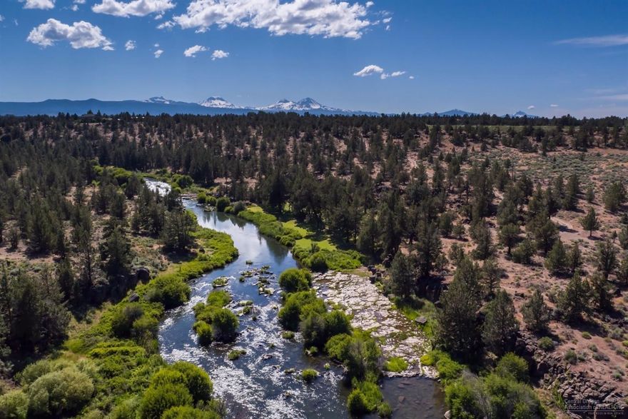 One of kind property with Deschutes River Frontage, Cascade mountain views and 33.5 acres of COI irrigation water rights. Secluded setting with trees pastures, hiking, swimming, fishing and boating with river access from property. Property includes 3 homes, 2 cabins, barn, pond, storage buildings and is currently used for livestock and recreation. A rare opportunity for a retreat or investment property with multiple dwellings and legal lots close to Bend and Redmond. Call for your private showing today!