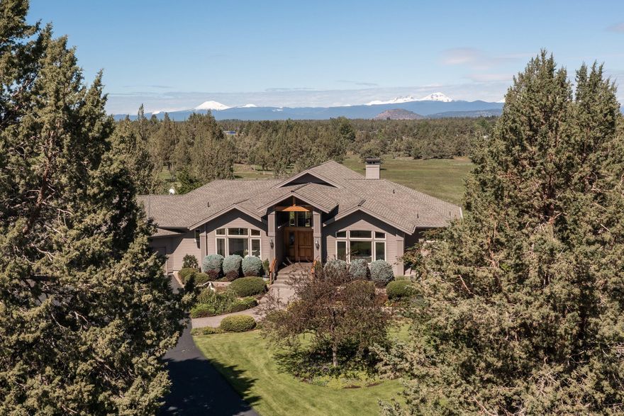 Gated 20 acre private country estate with unsurpassed panoramic cascade views. Custom single level home with light and bright vaulted ceiling great room overlooking expansive deck and sloped 12.5 irrigated pasture. Attached 850sf three car garage with built in cabinetry. Detached 780sf 2 bay shop with attached updated 375sf studio with half bath. Gated property sits on a private cul-de-sac and the paved driveway with split rail cedar fencing leading you to the magnificently landscaped entry. Quality finishes & features in and out and kitchen boasts gas range, slab granite counters and backsplash, stainless appliances, double ovens, kitchen island with prep sink, pot filler faucet over the Dacor range and large pantry. 2 gas fireplaces one in great room and one in the den which leads off to private side paver patio. Exterior amenities include expansive of mahogany decking running the width of the rear of the home, a fenced garden area, inground and timed irrigation system.